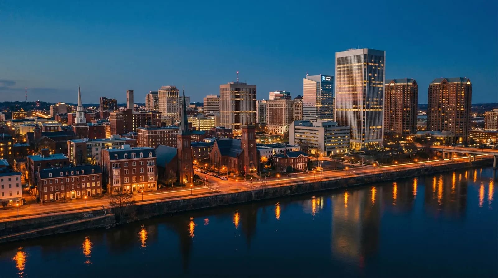 Richmond, Virginia skyline at dusk above the James River